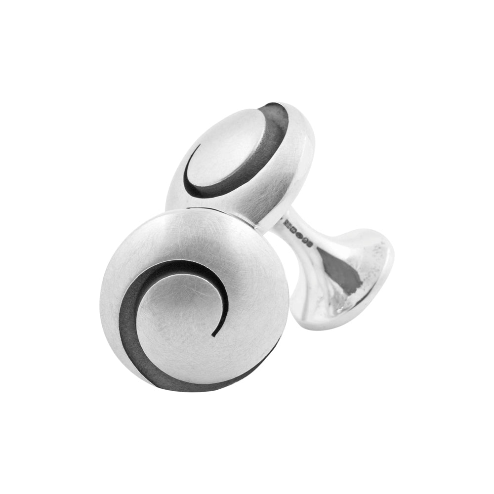Koru cufflinks in silver with oxidised recesses by Sarah Herriot.