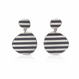 These silver op earrings really pop when worn, eye catching and lots of fun. They frame that face beautifully and will hang differently when swapped around.Op earrings by Sarah Herriot.
