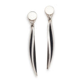 Long twist drop earrings have a elegant rhythmic twist and oxidised recesses to accentuate the design in silver.  Long twist drop earrings by Sarah Herriot.