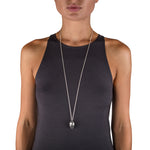 Manhattan pendant is a wonderfully solid pendant in silver, the form tapers to shaped rods of silver with oxidised recesses to accentuate the sculptural nature of the piece.  Manhattan pendant by Sarah Herriot.