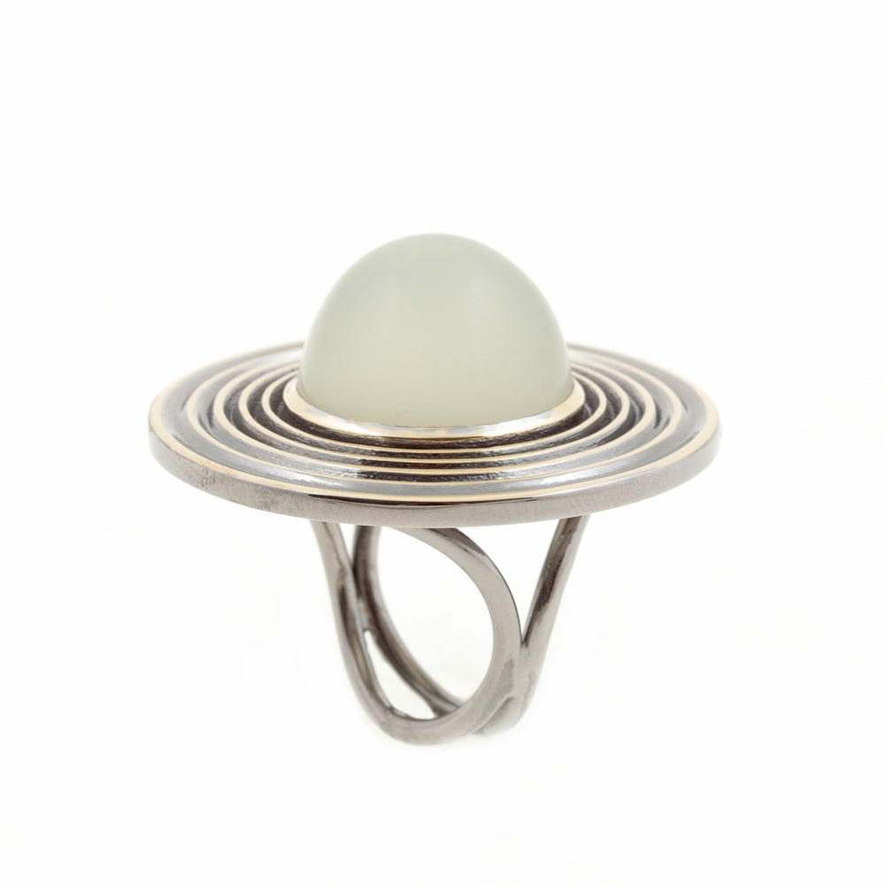Moon drop ring in 18ct gold with black rhodium plate and cabochon moonstone by Sarah Herriot.