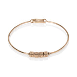 A playful bangle style can be personalised to feature initials or spell out a name or a word with a special meaning to you, many of my clients choose to spell out their children’s names. The cubes rotate freely on the bangle, and are engraved on all four sides, with any letter, character or set with 2mm round gemstone.