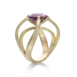 Papillion ring in 18ct gold using unusual bold and open yet strong setting which allows the stunning purple tourmaline to shine in all its glory. Papillion ring by Sarah Herriot.