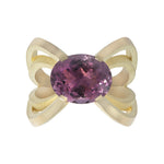 Papillion ring in 18ct gold using unusual bold and open yet strong setting which allows the stunning purple tourmaline to shine in all its glory. Papillion ring by Sarah Herriot.