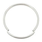 A solid silver torque featuring a seamless tension clasp, the ultimate in understated elegance. This timeless piece combines technical precision with minimalist design, offering effortless wearability without compromising on craftsmanshipTension neck torque by Sarah Herriot.