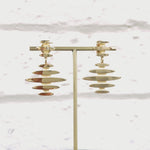 Mirage drop earrings, a stud and drop of flickering light in 18ct gold.  The mirage design is based the flickering line of light seen across the ocean waves as the sun sets.  Mirage earrings by Sarah Herriot.