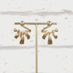 Acrobat earring are flowing loops of tapering 18ct gold tipped with a bright white diamond at the ear.  These earrings frame the ear beautifully, the loops making wonderful sculptural shapes. Acrobat earrings by Sarah Herriot.