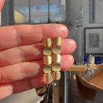 Tile drop earrings formed of linked squares with curved faces in18ct gold with a deep textured finish. Tile drop earrings by Sarah Herriot