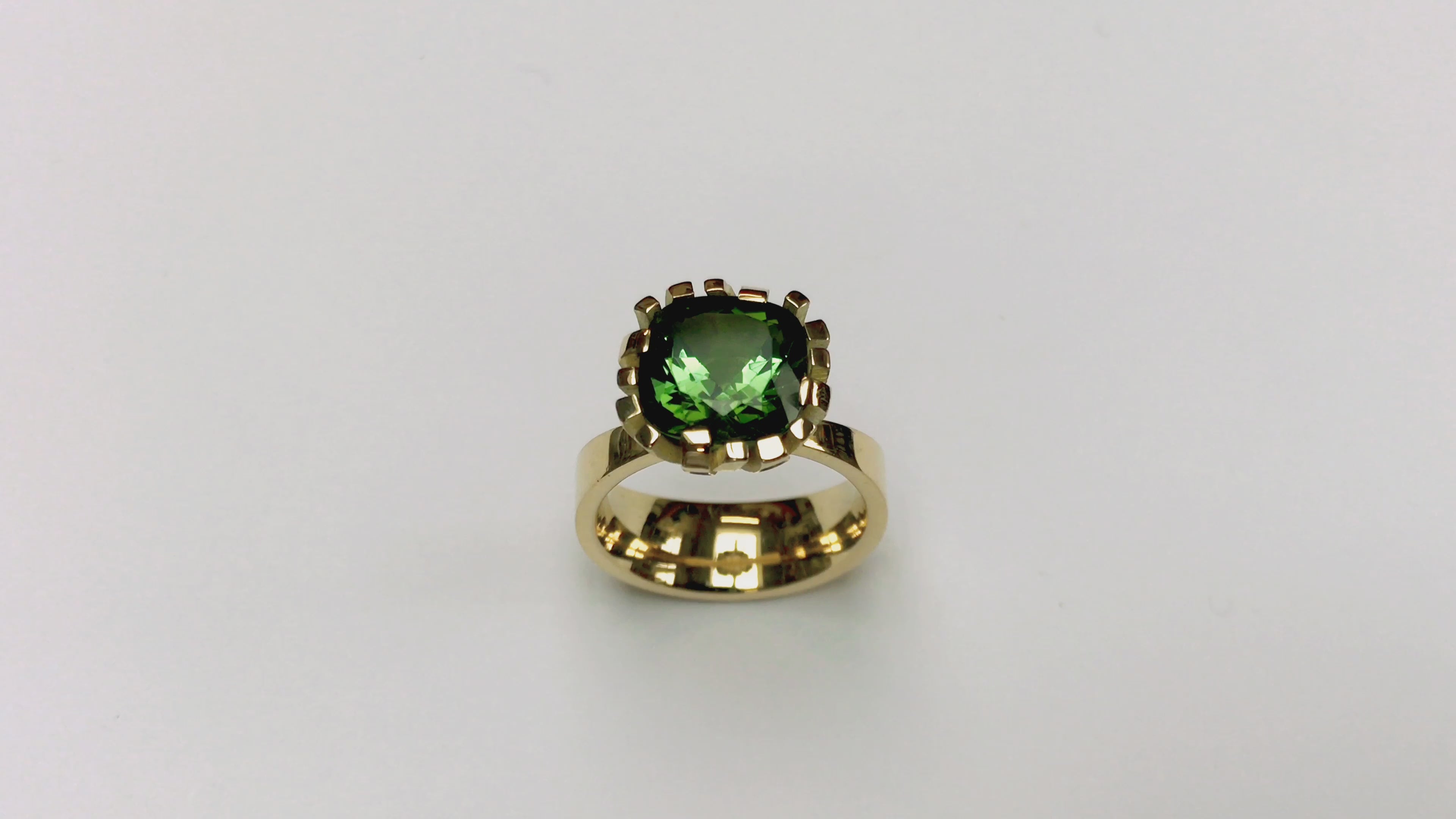 Flax ring in 18ct gold with cushion green tourmaline by Sarah Herriot.