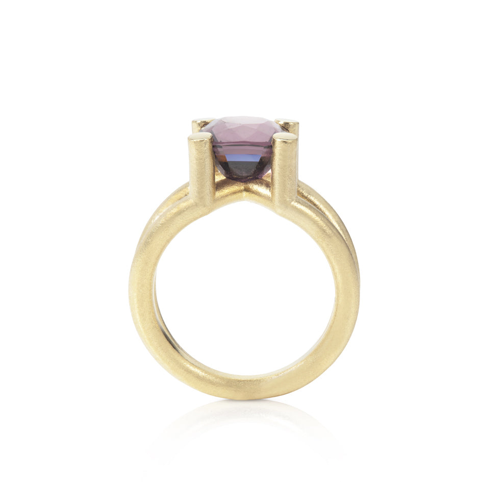 Scaffold ring in 18ct gold with cushion violet spinel by Sarah Herriot.