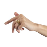 18ct gold ring made from single looping thread, a modern take on an eternity ring, sculptural form.  Acrobat ring by Sarah Herriot.