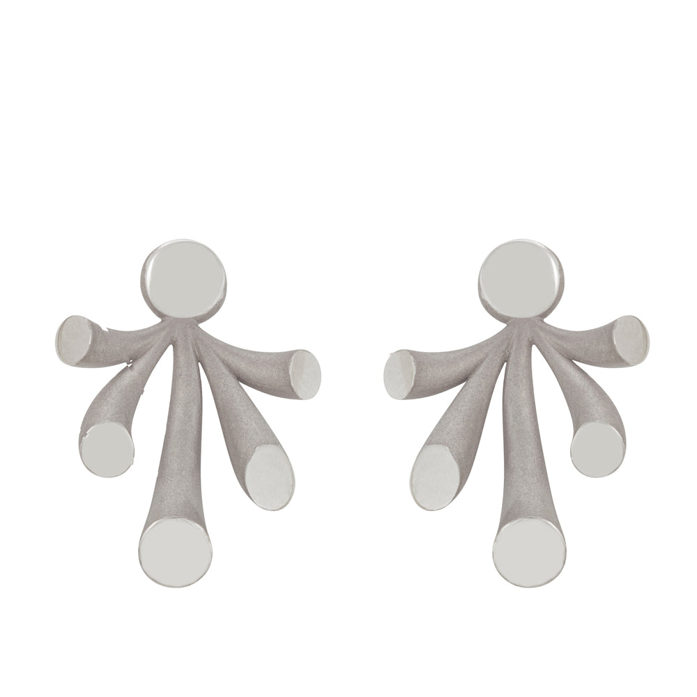 Splash ear jackets in polished and sandblasted silver with rhodium plating by Sarah Herriot.