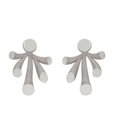 Splash ear jackets in polished and sandblasted silver with rhodium plating by Sarah Herriot.