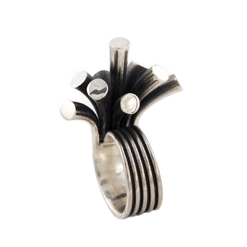 Splash ring in silver with oxidised recesses by Sarah Herriot.