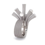 Splash ring in silver with sandblasted surfaces and rhodium plating by Sarah Herriot.