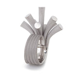 Splash ring in silver with sandblasted surfaces and rhodium plating by Sarah Herriot.
