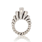 Silver ring made from single looping thread, a modern take on an eternity ring.  Acrobat ring by Sarah Herriot.