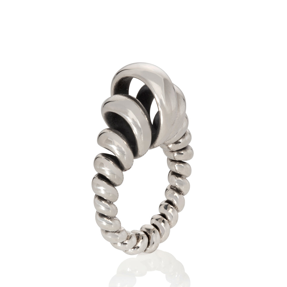 Silver ring made from single looping thread, a modern take on an eternity ring.  Acrobat ring by Sarah Herriot.