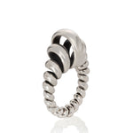 Silver ring made from single looping thread, a modern take on an eternity ring.  Acrobat ring by Sarah Herriot.