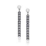 Stack drop earrings have a elegant jointed structure allowing the pieces to flicker in motion, a modern structure with oxidised recesses to accentuate the design in silver.  Stack earrings by Sarah Herriot.