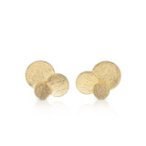 Staffa earrings are formed of overlaying discs of 18ct gold.  The design is inspired by fingal's cave on the Isle of Staffa off the west coast of Scotland. Textured surfaces echo the natural basalt rock formations. Staffa stud earrings by Sarah Herriot.