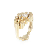 Staffa ring formed of undulating columns of 18ct gold and a scattering of seven vibrant blue Sri Lankan sapphires. The design is inspired by fingal's cave on the isle of staffa off the west coast of Scotland. Textured surfaces echo the natural basalt rock formations. Staffa reing by Sarah Herriot.