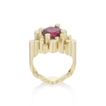 Staffa ring formed of undulating columns of 18ct gold and a stunning deep red rubellite tourmaline nestled within.  Staffa ring by Sarah Herriot.