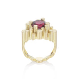 Staffa ring formed of undulating columns of 18ct gold and a stunning deep red rubellite tourmaline nestled within.  Staffa ring by Sarah Herriot.