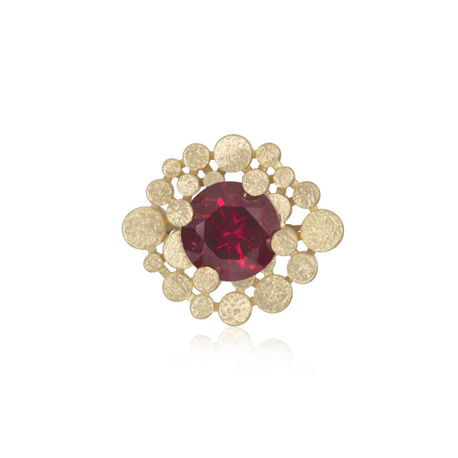 Staffa ring formed of undulating columns of 18ct gold and a stunning deep red rubellite tourmaline nestled within.  Staffa ring by Sarah Herriot.