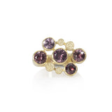 Staffa ring formed of undulating columns of 18ct gold with a scatter of mauve spinels in gorgeous shades.  Staffa ring by Sarah Herriot.