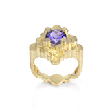 Staffa ring formed of undulating columns of 18ct gold and a gorgeous tanzanite nestled within.  Staffa ring by Sarah Herriot.