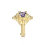 Staffa ring formed of undulating columns of 18ct gold and a gorgeous tanzanite nestled within.  Staffa ring by Sarah Herriot.