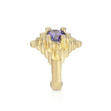Staffa ring formed of undulating columns of 18ct gold and a gorgeous tanzanite nestled within.  Staffa ring by Sarah Herriot.