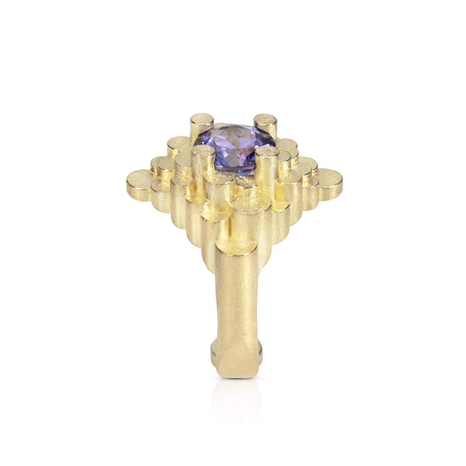 Staffa ring formed of undulating columns of 18ct gold and a gorgeous tanzanite nestled within.  Staffa ring by Sarah Herriot.