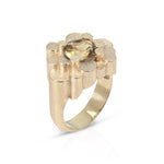 Staffa ring formed of undulating columns of 9ct gold and a golden tourmaline nestled within.  Staffa ring by Sarah Herriot.