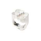 Magnificent staffa ring formed of columns of sterling silver with a raw textured surface. The design is inspired by fingal's cave on the isle of staffa off the west coast of Scotland. Textured surfaces echo the natural basalt rock formations. Staffa ring by Sarah Herriot.