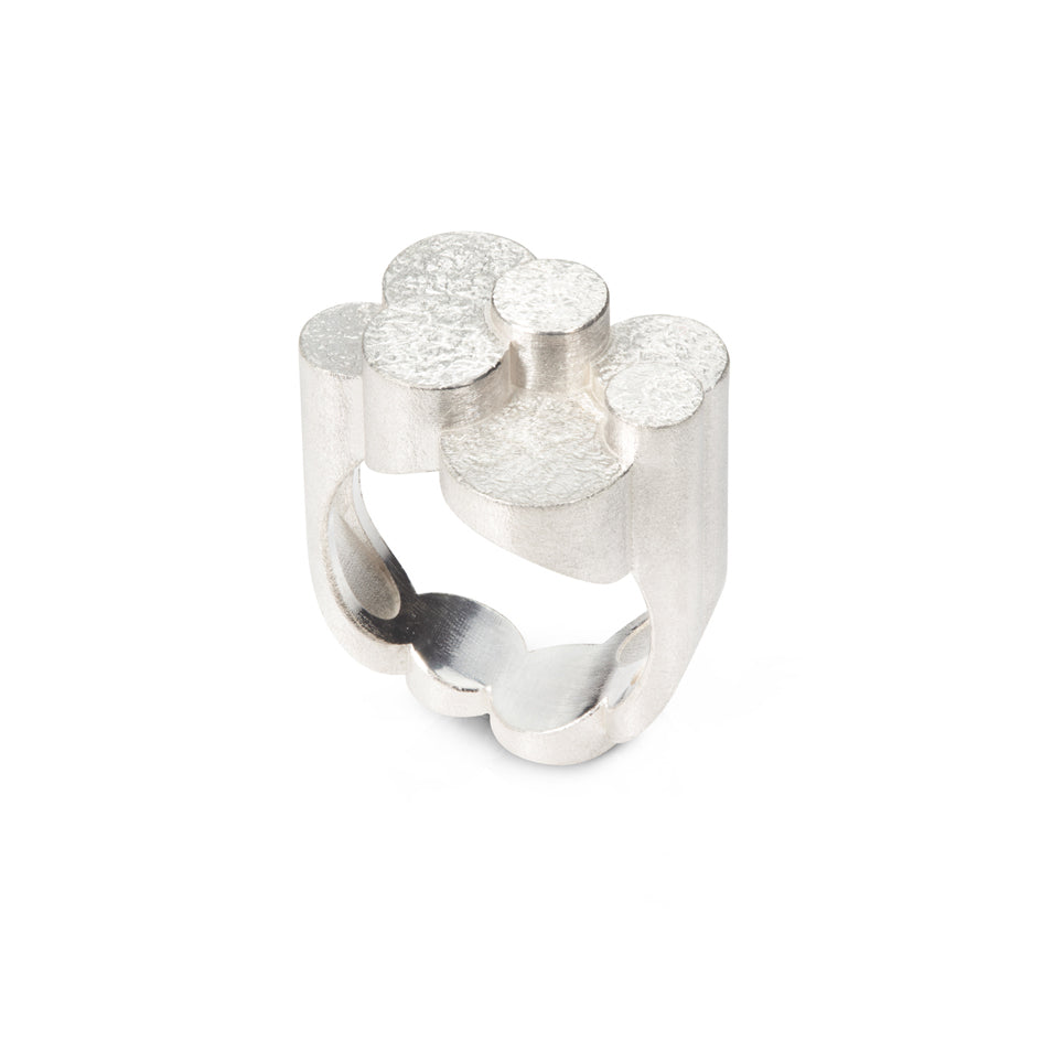 Magnificent staffa ring formed of columns of sterling silver with a raw textured surface. The design is inspired by fingal's cave on the isle of staffa off the west coast of Scotland. Textured surfaces echo the natural basalt rock formations. Staffa ring by Sarah Herriot.