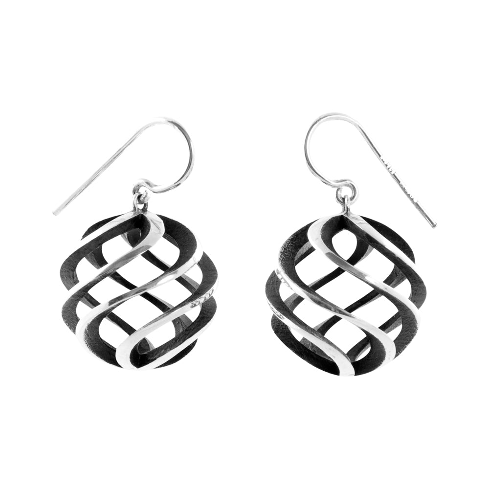 Large sun earrings in silver with oxidised interior by Sarah Herriot.