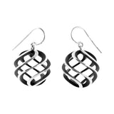 Large sun earrings in silver with oxidised interior by Sarah Herriot.