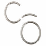 A masterfully engineered solid silver bangle with a seamless tension clasp that requires no visible mechanism. The round-section wire creates a refined, sculptural form that sits beautifully on the wrist with an authentic weight and presence. Seamless design embodies minimalist principles, pure form without ornamentation. Tension bangle by Sarah Herriot.