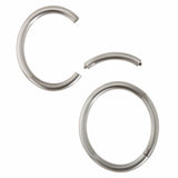 A masterfully engineered solid silver bangle with a seamless tension clasp that requires no visible mechanism. The round-section wire creates a refined, sculptural form that sits beautifully on the wrist with an authentic weight and presence. Seamless design embodies minimalist principles, pure form without ornamentation. Tension bangle by Sarah Herriot.