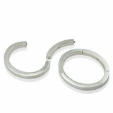A masterfully engineered solid silver bangle with a seamless tension clasp that requires no visible mechanism. The square-section wire creates a refined, sculptural form that sits beautifully on the wrist with an authentic weight and presence. Seamless design embodies minimalist principles, pure form without ornamentation.  Tension bangle by Sarah Herriot.