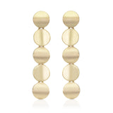 Round tile earrings in 18ct gold with undulating surface by Sarah Herriot.