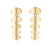 Tile drop earrings formed of a taper of ovals in18ct gold with deep textured finish, lovely movement. Tile earrings by Sarah Herriot.