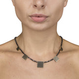 Black diamond cube neckpiece with linear 18ct gold pieces by Sarah Herriot.