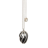 Twist and shout pendant is a wonderfully rythmic form in silver, constructed using open work twisted sheets of silver and oxidised or textured recesses to accentuate the sculptural nature of the piece.  Twist and shout pendant by Sarah Herriot.
