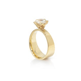 Twist collect tapered engagement ring and matching wedding band in 18ct gold with clients own round white diamond.  Twist collect ring set by Sarah Herriot.