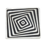 Vertigo brooch in silver with oxidised recesses by Sarah Herriot.