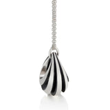 Object pendant is a wonderfully solid pendant in silver, the form tapers into flowing lines accentuated by the oxidised recesses, the form vaguely echoing a viking boat. Object pendant by Sarah Herriot.