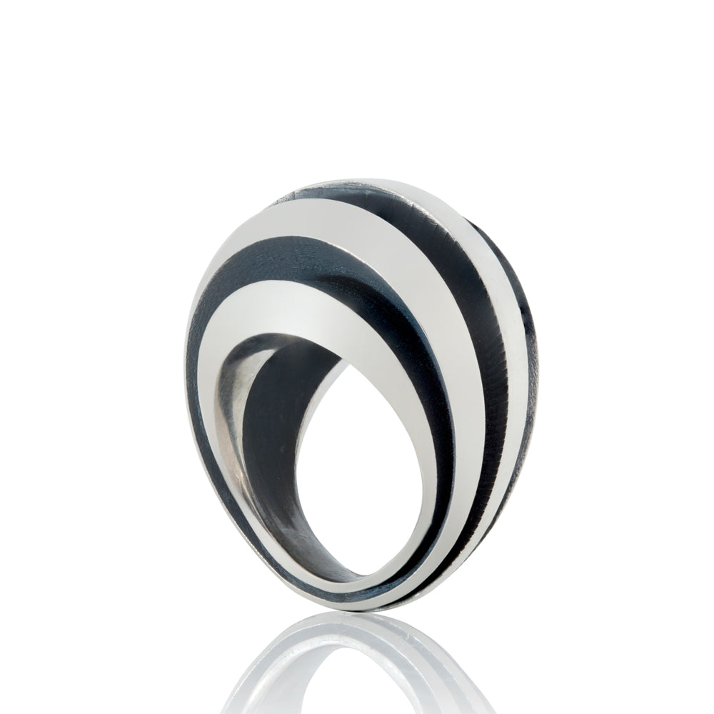 Object ring #1 is a free form sculptural ring design with looping tapered bands accentuated by oxidised recesses.  An abstract form with linear deconstruction. Object ring #1 by Sarah Herriot.